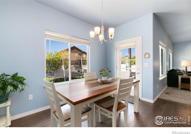 5664 Osbourne Dr, Windsor, CO 80550 - dining area with dark wood-style floors, a chandelier, and baseboards