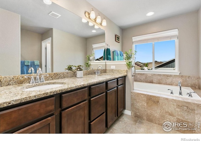 5664 Osbourne Dr, Windsor, CO 80550 - full bath with double vanity and a garden tub