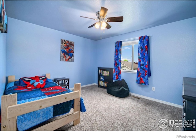 5664 Osbourne Dr, Windsor, CO 80550 - carpeted bedroom with baseboards and ceiling fan