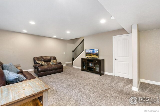 5664 Osbourne Dr, Windsor, CO 80550 - living area with carpet floors, stairway, baseboards, and recessed lighting