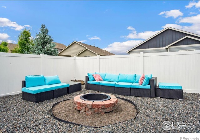 5664 Osbourne Dr, Windsor, CO 80550 - fenced backyard with an outdoor living space with a fire pit