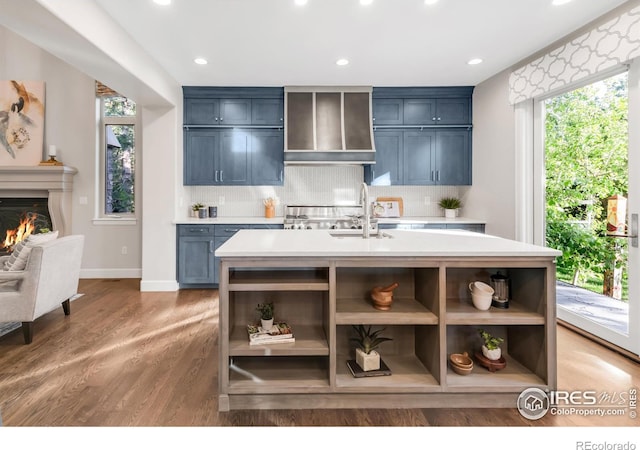 609 Corona Ct, Lafayette, CO 80026 - kitchen featuring open shelves, light countertops, extractor fan, decorative backsplash, and recessed lighting