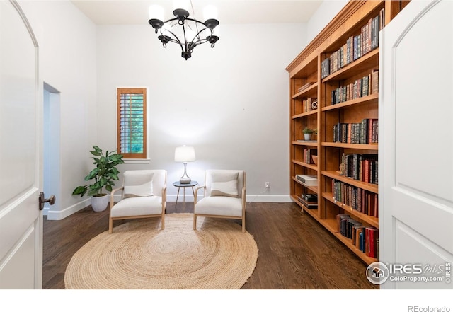 609 Corona Ct, Lafayette, CO 80026 - living area with a chandelier, wood finished floors, and baseboards