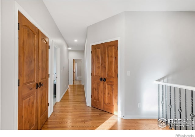 609 Corona Ct, Lafayette, CO 80026 - hall featuring recessed lighting, light wood-style flooring, and baseboards
