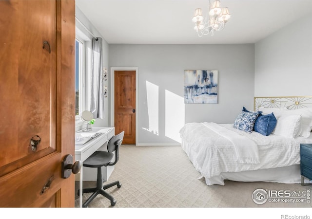609 Corona Ct, Lafayette, CO 80026 - bedroom with light carpet, an office area, and a chandelier