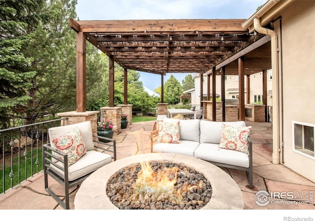 609 Corona Ct, Lafayette, CO 80026 - view of patio with an outdoor living space with a fire pit and a pergola