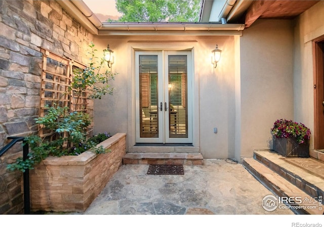 609 Corona Ct, Lafayette, CO 80026 - entrance to property with french doors, stucco siding, and stone siding