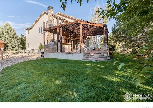 609 Corona Ct, Lafayette, CO 80026 - rear view of house with a wooden deck, stucco siding, a patio area, a chimney, and stone siding