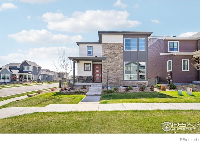 6211 Stable View St, Castle Pines, CO 80108 - contemporary house featuring stone siding and a front lawn