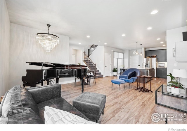 6211 Stable View St, Castle Pines, CO 80108 - living room featuring a chandelier, light wood-style flooring, recessed lighting, and stairs