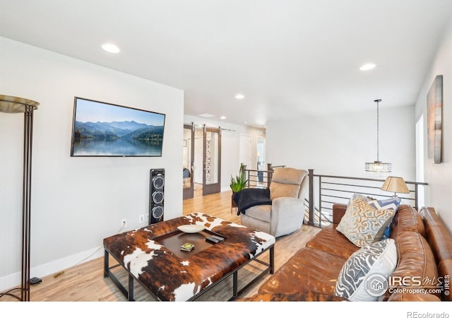 6211 Stable View St, Castle Pines, CO 80108 - living area with light wood-style flooring and recessed lighting
