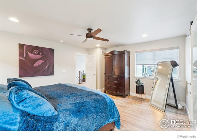 6211 Stable View St, Castle Pines, CO 80108 - bedroom with light wood-style flooring, a ceiling fan, recessed lighting, and baseboards