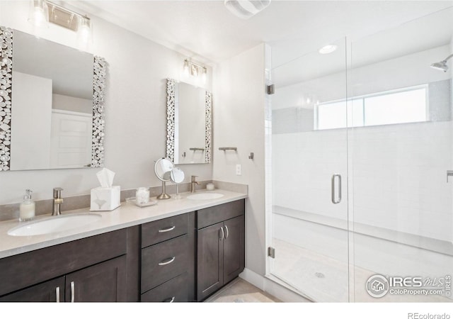 6211 Stable View St, Castle Pines, CO 80108 - bathroom featuring double vanity and a stall shower