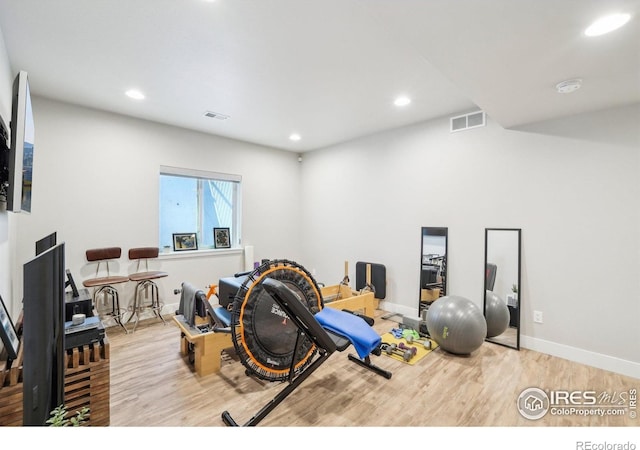 6211 Stable View St, Castle Pines, CO 80108 - workout area with wood finished floors, recessed lighting, and baseboards