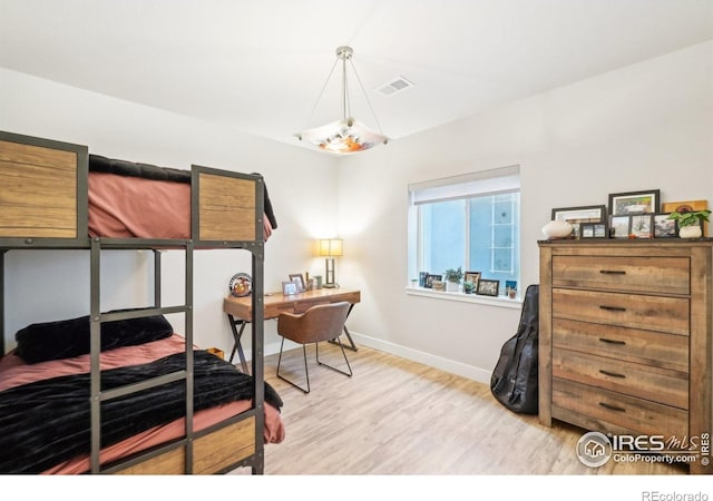 6211 Stable View St, Castle Pines, CO 80108 - bedroom featuring light wood-style flooring and baseboards
