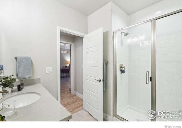 6211 Stable View St, Castle Pines, CO 80108 - bathroom featuring a shower stall and vanity