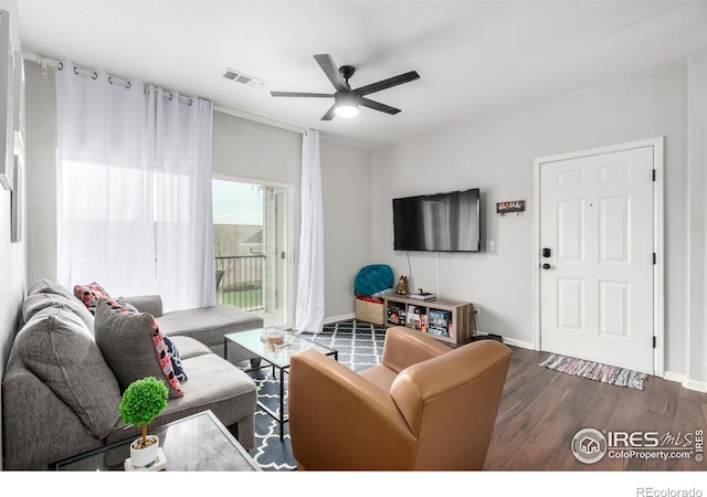 4451 S Ammons St Unit 307, Littleton, CO 80123 - living room featuring a ceiling fan, wood finished floors, and baseboards