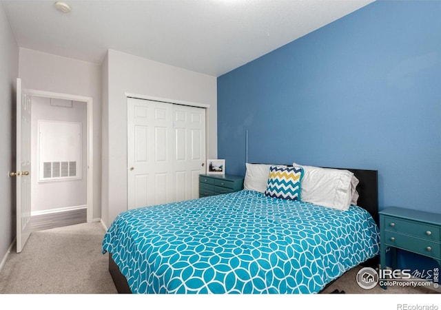 4451 S Ammons St Unit 307, Littleton, CO 80123 - bedroom with carpet, a closet, and baseboards