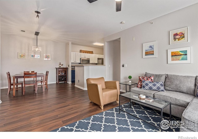 4451 S Ammons St Unit 307, Littleton, CO 80123 - living room featuring dark wood-style floors and a ceiling fan
