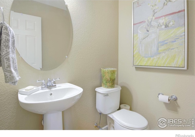 2085 Tundra Cir, Erie, CO 80516 - half bathroom featuring toilet and a sink