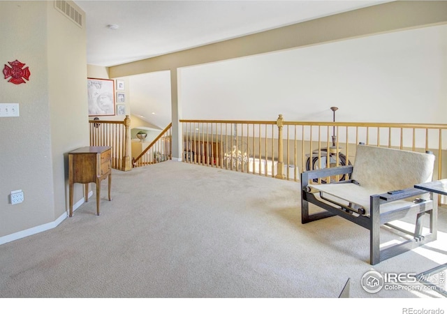 2085 Tundra Cir, Erie, CO 80516 - living area featuring carpet and an upstairs landing