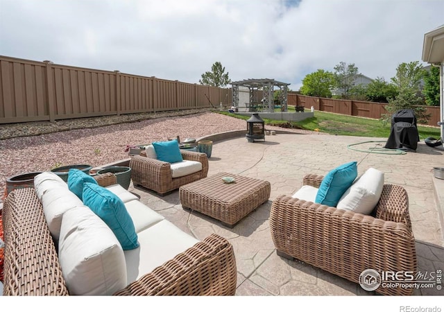 2085 Tundra Cir, Erie, CO 80516 - fenced backyard with an outdoor hangout area, a pergola, and a patio area