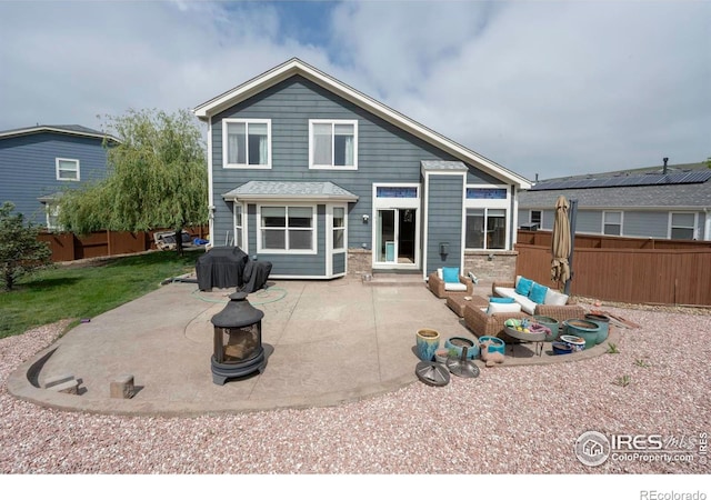 2085 Tundra Cir, Erie, CO 80516 - rear view of house featuring a patio and outdoor lounge area