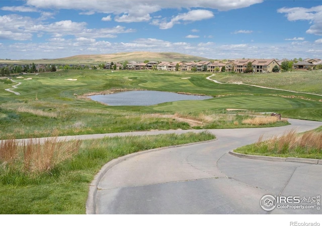 2085 Tundra Cir, Erie, CO 80516 - surrounding community featuring a water and mountain view, view of golf course, and a residential view