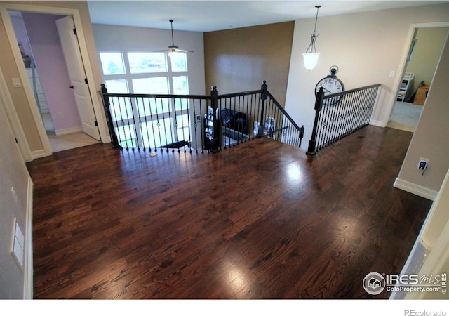 3106 Megan Way, Berthoud, CO 80513 - empty room featuring wood finished floors, ceiling fan, and baseboards