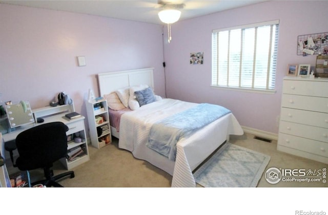 3106 Megan Way, Berthoud, CO 80513 - bedroom featuring light colored carpet, an office area, a ceiling fan, and baseboards