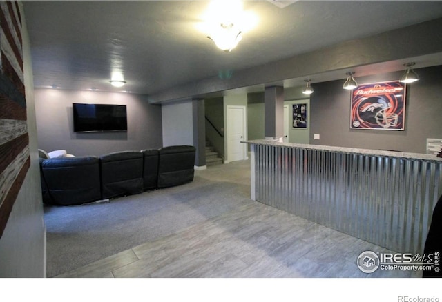 3106 Megan Way, Berthoud, CO 80513 - living area featuring stairway and wood finished floors