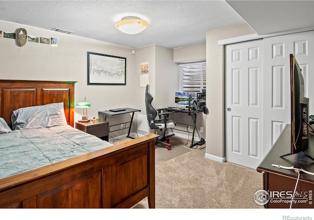 23570 E Holly Hills Way, Parker, CO 80138 - bedroom with a textured ceiling, carpet floors, a closet, an office area, and baseboards