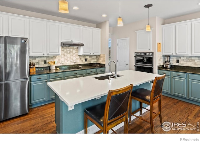 23570 E Holly Hills Way, Parker, CO 80138 - kitchen with freestanding refrigerator, a sink, double wall oven, decorative backsplash, and white cabinetry