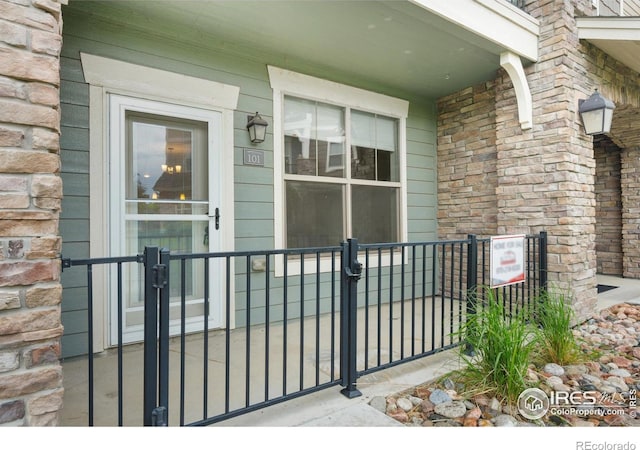 4672 Hahns Peak Dr Unit 101, Loveland, CO 80538 - property entrance with a porch