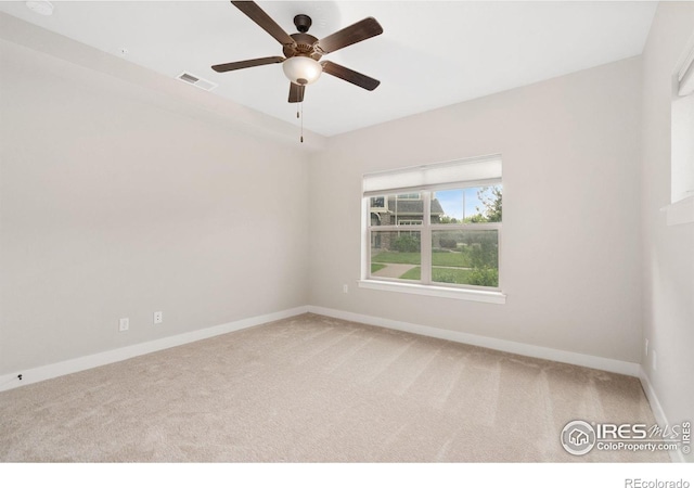 4672 Hahns Peak Dr Unit 101, Loveland, CO 80538 - spare room with carpet floors, baseboards, and a ceiling fan