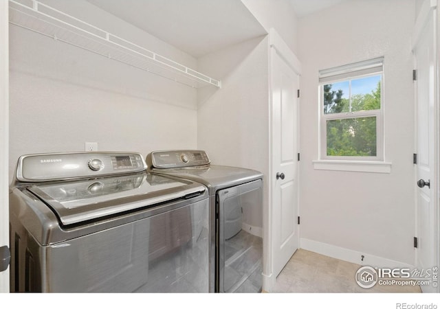 4672 Hahns Peak Dr Unit 101, Loveland, CO 80538 - laundry room with independent washer and dryer and baseboards