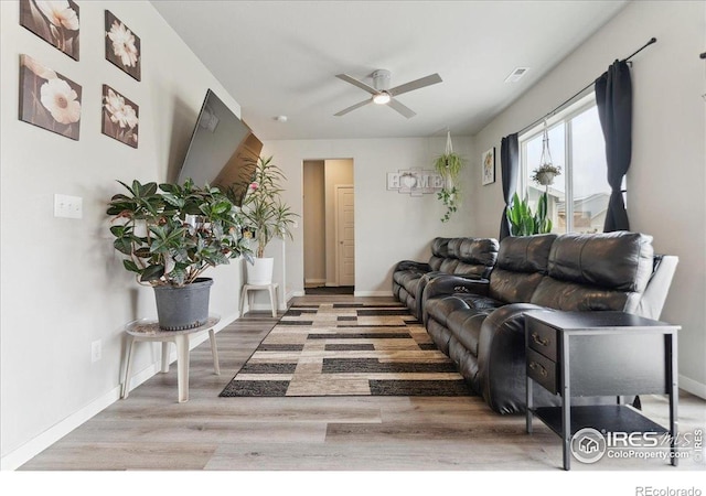 608 Apex Trl, Ault, CO 80610 - living room with wood finished floors, ceiling fan, and baseboards