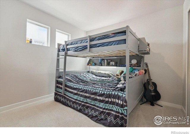 608 Apex Trl, Ault, CO 80610 - carpeted bedroom featuring baseboards