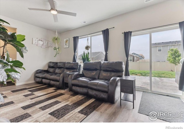 608 Apex Trl, Ault, CO 80610 - living room with wood finished floors, a ceiling fan, and baseboards