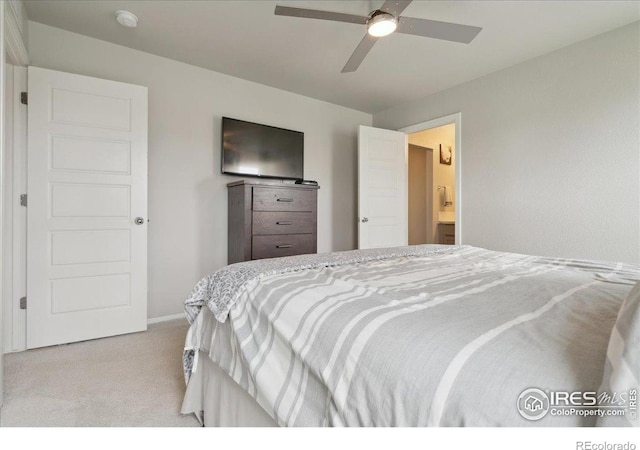 608 Apex Trl, Ault, CO 80610 - carpeted bedroom featuring baseboards, ceiling fan, and ensuite bathroom