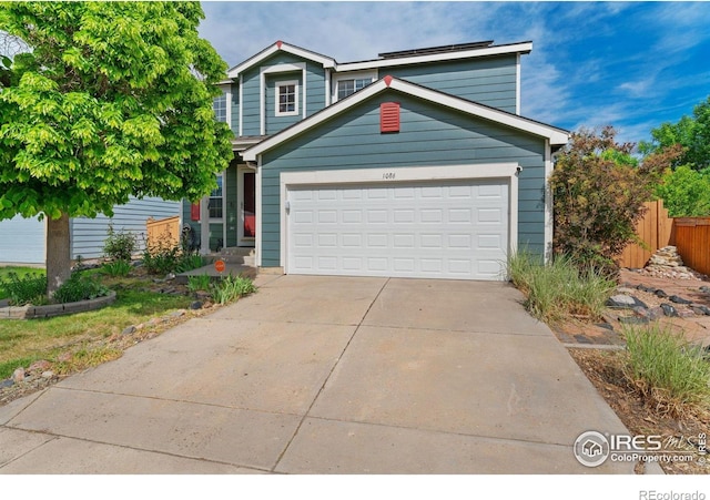 1086 Mockingbird St, Brighton, CO 80601 - traditional-style house with driveway and an attached garage
