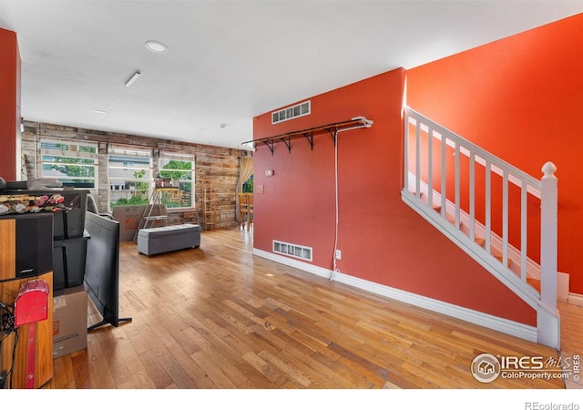 1086 Mockingbird St, Brighton, CO 80601 - living room with hardwood / wood-style flooring, baseboards, stairway, and recessed lighting