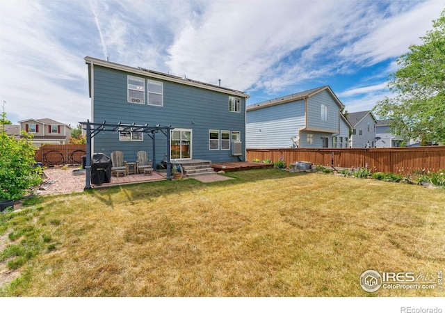 1086 Mockingbird St, Brighton, CO 80601 - back of property with a pergola, a wooden deck, and a patio area