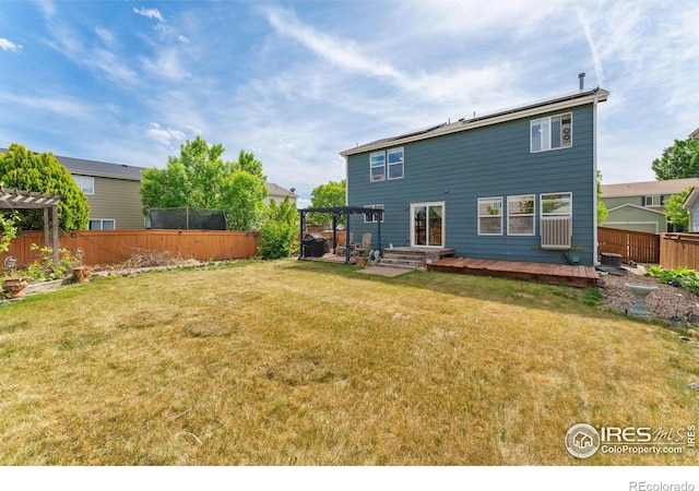 1086 Mockingbird St, Brighton, CO 80601 - back of property featuring a pergola and a wooden deck