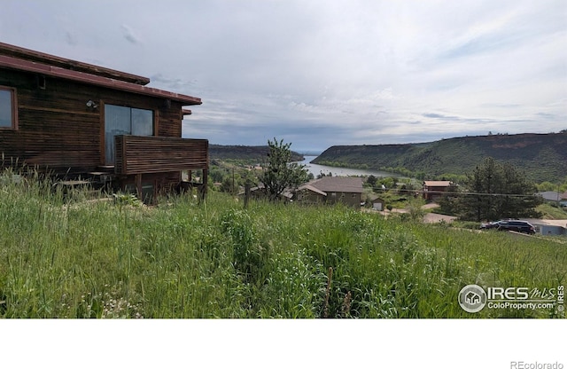 4633 Canyon View Dr, Fort Collins, CO 80526 - view of yard featuring a water and mountain view