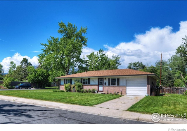855 33rd St, Boulder, CO 80303 - single story home with brick siding, an attached garage, and driveway