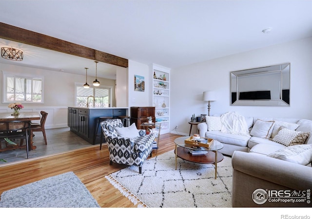 855 33rd St, Boulder, CO 80303 - living room featuring wood finished floors and built in shelves