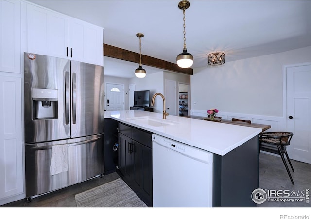 855 33rd St, Boulder, CO 80303 - kitchen featuring stainless steel fridge with ice dispenser, white dishwasher, a sink, dark tile patterned floors, and wainscoting