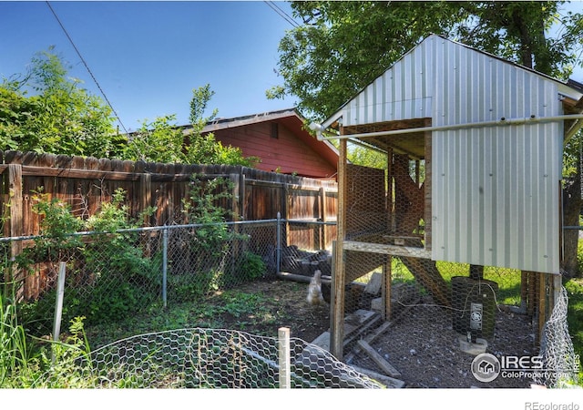 855 33rd St, Boulder, CO 80303 - fenced backyard featuring an outbuilding and exterior structure
