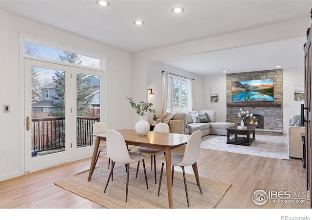 4094 Bimini Ct, Boulder, CO 80301 - dining area with light wood-type flooring, recessed lighting, and a stone fireplace